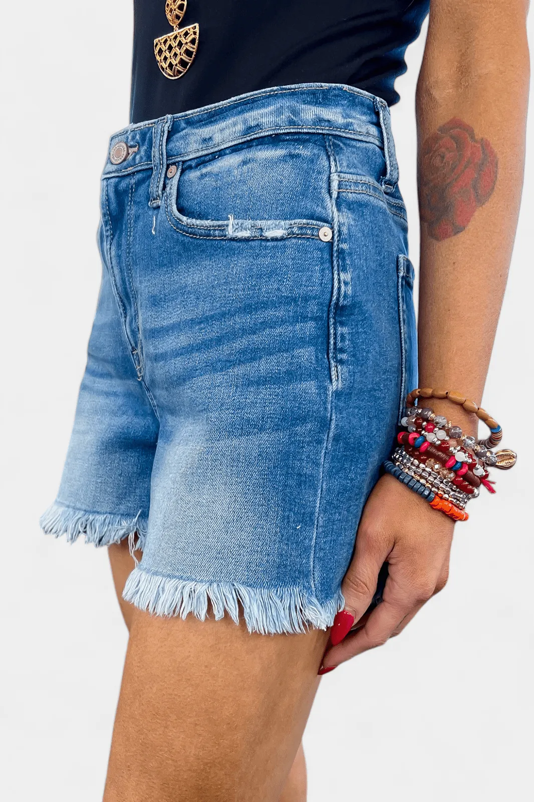 Medium Wash Mid Rise Raw Hem Denim Shorts