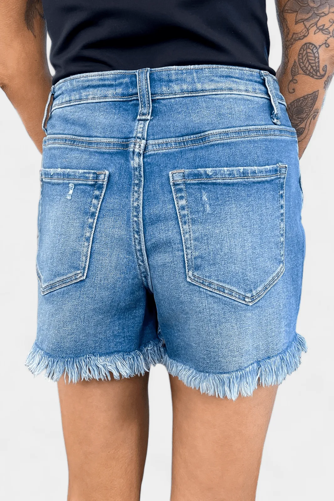 Medium Wash Mid Rise Raw Hem Denim Shorts